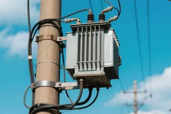 Power pole transformer on a distribution line