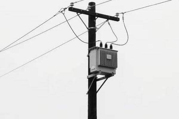 Rural power pole transformer in a remote setting
